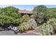 Condo exteriors surrounded by lush landscaping including palm trees, showcasing a well maintained parking area at 9501 Shore Dr. # B-224, Myrtle Beach, SC 29572