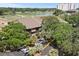 Exterior view of Mariners Cove complex with lush trees surrounding the building showcasing the natural landscape and parking at 9501 Shore Dr. # B-224, Myrtle Beach, SC 29572