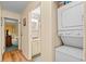 Hallway featuring laundry closet with stacked washer and dryer, access to bathroom and bedroom at 9501 Shore Dr. # B-224, Myrtle Beach, SC 29572