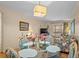 Combined living and dining area, featuring seating, a dining table, and outdoor views at 9501 Shore Dr. # B-224, Myrtle Beach, SC 29572