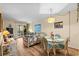 Inviting living area featuring dining space, lounge seating, and access to the screened-in porch at 9501 Shore Dr. # B-224, Myrtle Beach, SC 29572