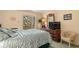 Relaxing main bedroom with a large bed, dresser, and access to a balcony at 9501 Shore Dr. # B-224, Myrtle Beach, SC 29572