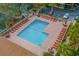 Aerial view of pool with lounge chairs, tables, and well-maintained landscaping at 9501 Shore Dr. # B-224, Myrtle Beach, SC 29572