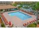 Aerial view of pool with lounge chairs, tables, and well-maintained landscaping at 9501 Shore Dr. # B-224, Myrtle Beach, SC 29572