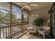Relaxing porch with seating, ceiling fan, screened windows, and treelined views at 9501 Shore Dr. # B-224, Myrtle Beach, SC 29572