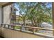 Balcony with metal railing offers views of trees, a parking lot and swimming pool area at 9501 Shore Dr. # B-224, Myrtle Beach, SC 29572