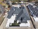 Aerial view of a sprawling home with a dark roof, a backyard pool, and well-kept surroundings at 4302 Gray Heron Dr., North Myrtle Beach, SC 29582