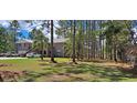 Brick home with a large yard and mature trees at 7101 Choppee Rd., Georgetown, SC 29440