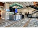 Well-lit coffee bar in lobby features tile floors, convenient staircase, and visible digital menu boards at 1501 S Ocean Blvd. # 1048, Myrtle Beach, SC 29577