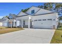 Single-story home with a well-manicured lawn and a spacious two-car garage at 546 Beckham Ct., Murrells Inlet, SC 29576