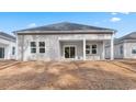 Gray house with covered patio and surrounding yard at 552 Beckham Ct., Murrells Inlet, SC 29576