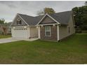 Side view of house showcasing stone accents at 1023 Meares St., Calabash, NC 28467