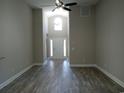 Spacious living room with high ceilings and wood-look floors at 1023 Meares St., Calabash, NC 28467