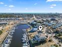 Property location shown in an aerial view, near the waterway with many boats at 1316 Marina Bay Dr., North Myrtle Beach, SC 29582