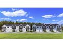 Row of townhouses in a new development at 718 Nw Palm Frond Way # 66, Calabash, NC 28467