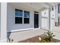 Two-story home with black front door and white siding at 718 Nw Palm Frond Way # 66, Calabash, NC 28467