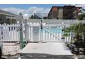 White-fenced community pool with gate at 6305 N Ocean Blvd. # B-3, North Myrtle Beach, SC 29582