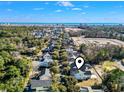 Scenic aerial view of a community, showcasing ocean views and nearby amenities at 1604 James Island Ave., North Myrtle Beach, SC 29582