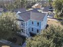 Stunning aerial view of a light blue two-story home with double porches at 1604 James Island Ave., North Myrtle Beach, SC 29582