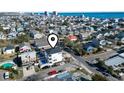 Aerial view of the home, highlighting proximity to nearby houses, streets, and the ocean at 2401 Duffy St., North Myrtle Beach, SC 29582