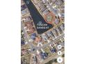 Aerial view of land parcel in Tuscan Sands at Grande Dunes with surrounding homes and lake at 2115 Mirabel Ct., North Myrtle Beach, SC 29582