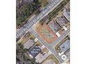 Aerial view of a residential lot surrounded by established homes and lush green trees at 5508 Via Verde Dr., North Myrtle Beach, SC 29582