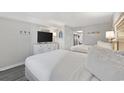 Comfortable bedroom featuring two beds, a dresser, and a view into the hall and kitchen at 2401 S Ocean Blvd. # 1156, Myrtle Beach, SC 29577