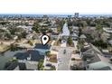 Aerial view of a blue coastal home situated on a canal in a vibrant neighborhood at 2307 Tortuga Ln., North Myrtle Beach, SC 29582