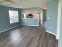 Open-concept living space featuring modern flooring and a breakfast bar to the kitchen at 5020 Windsor Green Way # 103, Myrtle Beach, SC 29579