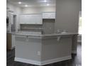 Stylish kitchen features white cabinets, stainless steel appliances, and granite countertops at Tbd5 Privetts Rd., Conway, SC 29526
