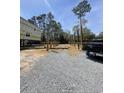 New construction home with a foundation being built in a neighborhood with a truck at 723 10Th Ave. S, Surfside Beach, SC 29575