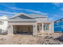 Exterior view of new brick home featuring an attached garage and covered entryway, blending style and functionality at 835 Crescent Sable Ct., Myrtle Beach, SC 29572