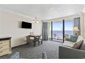 Inviting living room featuring a dining area, sofa, and a balcony overlooking the ocean at 1105 S Ocean Blvd. # 904, Myrtle Beach, SC 29577
