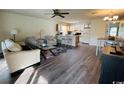 Open concept living and dining area with modern flooring, ceiling fan, and an airy feel at 923 Fairwood Lakes Ln. # 23-Q, Myrtle Beach, SC 29588