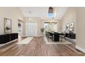 Spacious dining room with hardwood floors and large windows at 598 Summer Green Ct., Sunset Beach, NC 28468