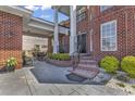 Elegant entrance with brick steps, iron railing and lush landscaping at 816 Waterton Ave., Myrtle Beach, SC 29579