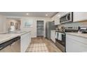 Open kitchen featuring stainless steel appliances and an adjacent pantry at 119 Cambridge Dr., Tabor City, NC 28463