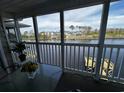 Screened in porch with outdoor furniture overlooking water at 220 Landing Rd. # I, North Myrtle Beach, SC 29582