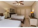 Two twin beds, nightstands, and a dresser in a bedroom at 100 North Beach Blvd. # 518, North Myrtle Beach, SC 29582