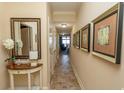 Elegant hallway with tiled floors and framed art at 100 North Beach Blvd. # 518, North Myrtle Beach, SC 29582