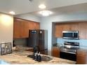 Modern kitchen with stainless steel appliances and beautiful granite countertops at 2100 Sea Mountain Hwy. # 628, North Myrtle Beach, SC 29582