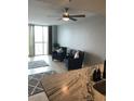 Living room featuring modern decor and plenty of natural light from a large window at 2100 Sea Mountain Hwy. # 628, North Myrtle Beach, SC 29582