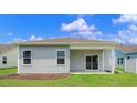 Back of the home featuring a patio and sliding glass door to the interior at 3035 Deerberry Place, Longs, SC 29568