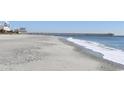 Beautiful beach scene with calming waves and a pier stretching into the ocean at 9550 Shore Dr. # 925, Myrtle Beach, SC 29572