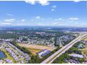 Extensive aerial view showcasing community near a highway and a coastal skyline at 293 Sandridgebury Dr. # 66, Little River, SC 29566
