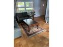 Inviting living room with hardwood floors, featuring comfortable seating and natural light from large windows at 660 Cardinal Ave. # 660, Myrtle Beach, SC 29577