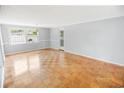 Spacious living room featuring parquet flooring and neutral walls at 660 Cardinal Ave. # 660, Myrtle Beach, SC 29577