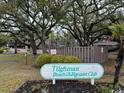 Tilghman Beach and Racquet Club entrance sign with mature trees and well maintained landscaping at 212 2Nd Ave. N # 362, North Myrtle Beach, SC 29582