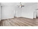 Bright and spacious living room with hardwood floors and ceiling fan at 734 Woodside Dr., Conway, SC 29526