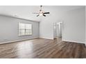 Large main bedroom with hardwood floors and ceiling fan at 734 Woodside Dr., Conway, SC 29526